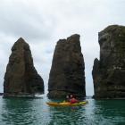Sue Maturin kayaks around the Frances Pillars. Photos by Fergus Sutherland/Helena de Reus.