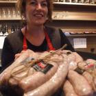 Sue Morton with Waitaki Bacon and Ham's rustic pork sausage, which is a finalist in the retail...