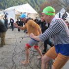 Sunrise presenters David Koch (left) and Mark Beretta brace themselves for a brisk dip in Lake...
