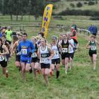 Susannah Lynch (left), a member of the open women's winning Hill City University team, leads out...