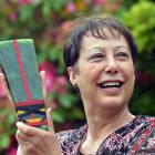 Suzanne Renner at home with her Kowhiti lifetime achievement award last week. Photo by Peter...