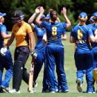 Suzie Bates' team-mates congratulate Bates after her dismissal of Wellington Blaze opener Anne...