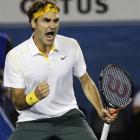 Switzerland's Roger Federer celebrates during his second round win over France's Gilles Simon at...