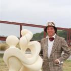 Symposium chairman Matt King with Ruth Killoran's interpretation of Alice and the Caterpillar.