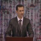 Syrian President Bashar al-Assad speaks at the Opera House in Damascus in this still image taken...