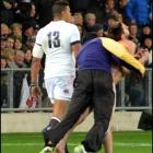 A streaker is tackled by security  worker Brad Hemopo at the All Blacks versus England test match...