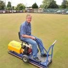 Taieri Bowling Club manager and green keeper Rob Gibson prepares the green to host the national...