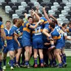 Taieri celebrates its win against University A in the Dunedin Premier rugby final in front of...