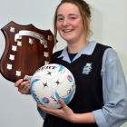 Taieri College netballer Rachel Beattie with the Lois Muir Shield, a trophy won by Taieri College...