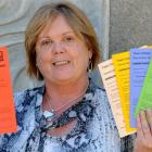 Taieri College principal Christina Herrick holds the range of cards used as part of the school's...