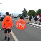 Taieri College school patrol member Zac Henry (12), from Mosgiel, waits while his fellow pupils ...