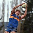 Taieri lock Josh Larsen takes the ball during a lineout in the game against Southern at Peter...