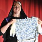 Taieri Musical Society marketing manager Ben Thomas gets to grips with some of the costume...