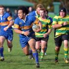 Taieri prop Aki Seiuli on the burst against Green Island at Miller Park last Saturday. Also...