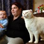 Tamara Smith with son Jaxon and cat Whitey in her South Dunedin home yesterday. Photo by Peter...