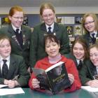 Tania Roxborogh (centre) with a copy of Banquo's Son and her Columba College advisers (front from...