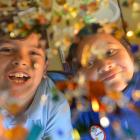 Te Kura Kaupapa Maori o Otepoti pupils Tumai Campbell (7) and Jazmine Tau (9) inspect recycled...
