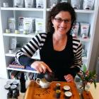 Tea Global Ltd director Michelle Casson pours Phoenix Mountain Oolong tea as part of the...