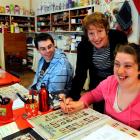 Teacher Trudy Scott helps Aaron Williams (30), of Mosgiel, and Meghan McNeill (23), of Dunedin,...