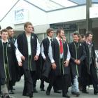 Telford diploma of rural business graduates brave strong winds as they parade through the main...