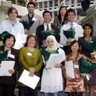 Ten of the 11 people who became New Zealand citizens this week are: (front, from left) Hop Thi...