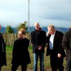 Testing the cellphone reception at the new Telecom tower  near Tapanui yesterday are, from left,...