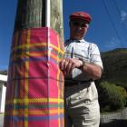 Teviot Valley Scottish Week organising committee member Ken Bain checks the festive sleeves on...