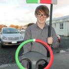 Thani  McLaren  shows the prototype of his  device to help foreign drivers keep left on New...