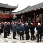 The 16-member Shanghai delegation and invited guests listen to speeches at yesterday's memorandum...
