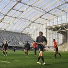 The All Blacks, including Otago's Adam Thomson (with the ball), train at Forsyth Barr Stadium in...