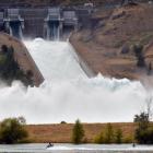 The Benmore and Clyde Dams, both spilling at full force in early 2013. PHOTOS: ODT FILES
