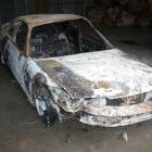 The burnt-out Nissan Skyline which police say is linked to the death of an 18-year-old...