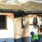 The  Clinton house damaged by fire yesterday morning. Photo: Hamish MacLean
