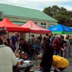 The crowd gathers around the flea market stalls. Photo by Peter Dowden.