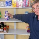 The cupboard is bare: Gore Salvation Army social worker Tom Banks surveys the empty spaces on the...