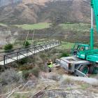 The final bridge on the Gibbston River Trail is carefully lowered into place. Photo supplied.