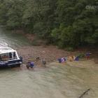 The Fiordland Express collects Milford Track trampers yesterday. Photo by One News.