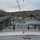 The first of the two new bridges being built over the Waitaki River begins to take shape this...