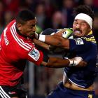 The Highlanders' Ash Dixon tries to get past Jimmy Tupou of the Crusaders. Photo by Getty Images