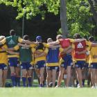 The Highlanders huddle during training at Logan Park yesterday. Photo by Peter McIntosh.