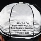 The inscription on the back of Muliaina's 100th match cap. Photo by Reuters.