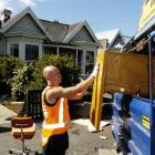 The late Andrew Simes loads unwanted furniture into a rubbish truck during a collection in the...