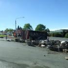 The load of the truck's rear trailer spilled on to the road as the rtuck was heading out of...