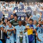 The Manchester City team celebrate winning the English Premier League following their match...