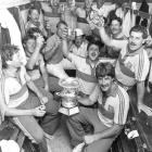 The Otago cricketers, with Warren Lees in front holding the trophy, celebrate Shell Cup victory...