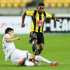 The Phoenix's Roy Krishna tries to avoid the tackle of Wanderer Daniel Alessi. Photo Getty Images