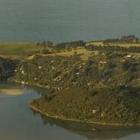 The Potato Point headland and Purakaunui township. Photo by Darren Scott.