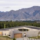 The roofline echoes the mountains around, while the low profile house is bunkered into its...