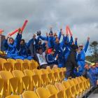 The Samoan men's hockey team cheers on the women's team from salvaged Carisbrook seats installed...