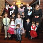 The Taha family, from Syria, are (top row, from left) Lina, Heba (8 weeks) Mouhannod, Izdehar,...